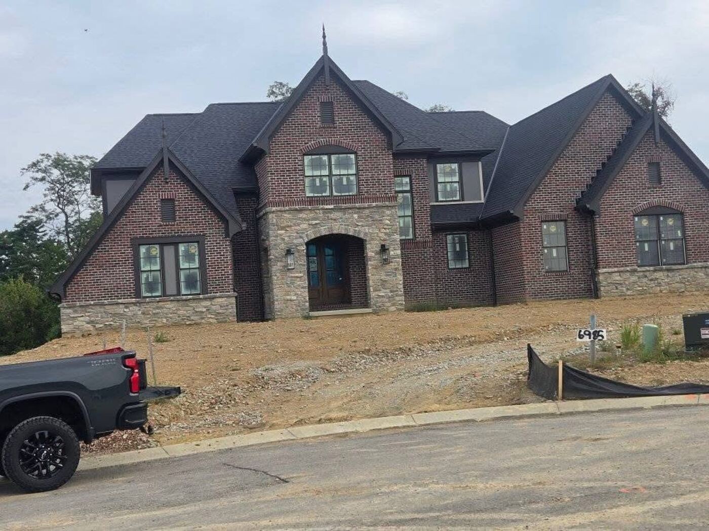 Brick gable end of a custom residence with clean coursing